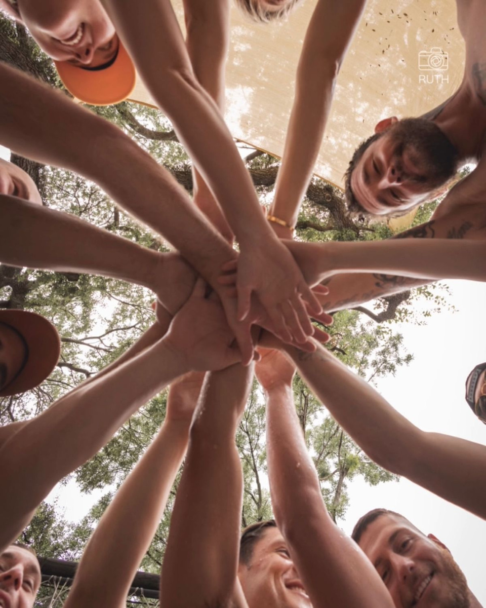 Hands joined together in community